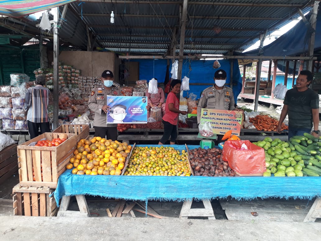 Polsek Kuala Kampar Sosialisasikan Protokol Kesehatan di Pasar
